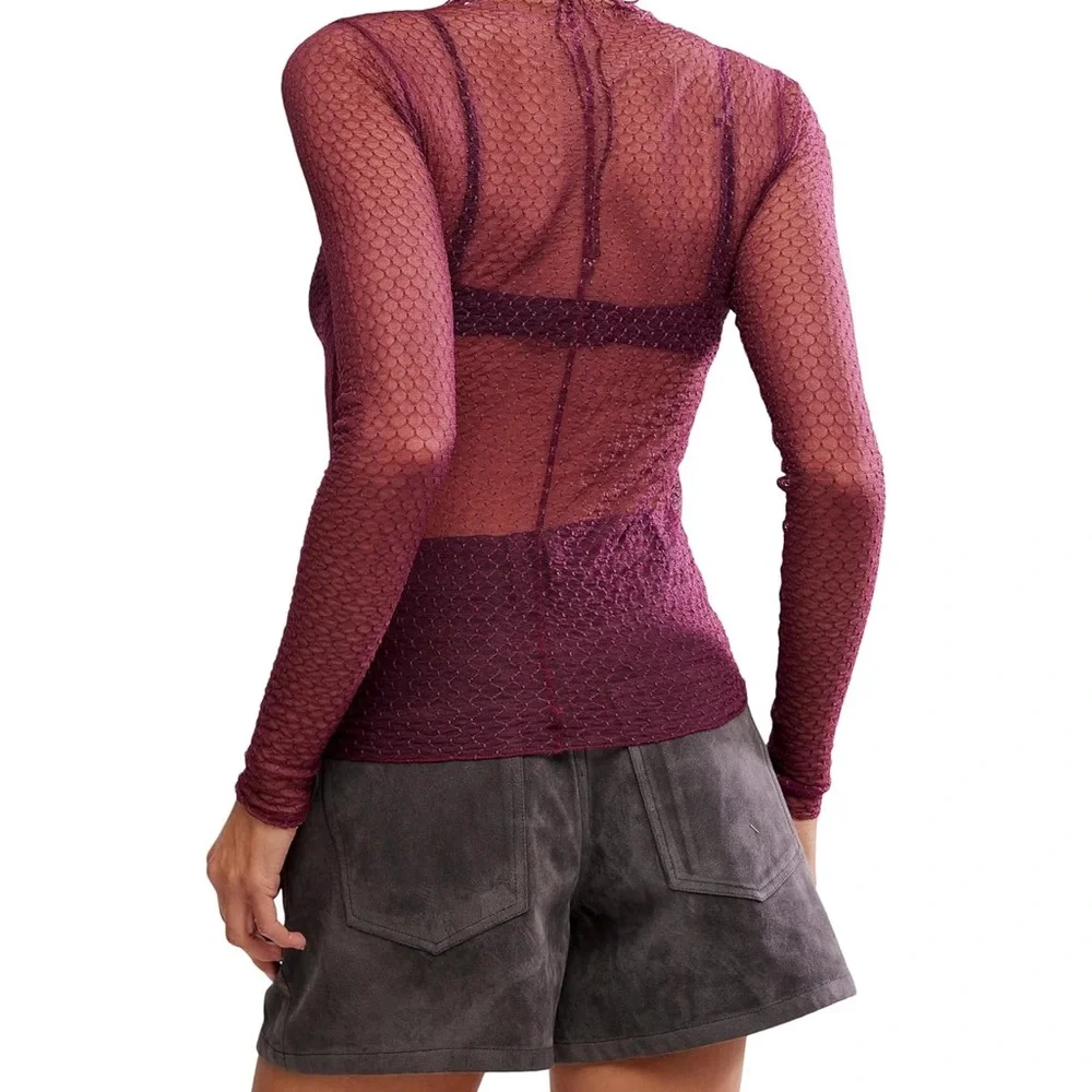 NWOT Free People minding my business top NWOT plum, black and pink available